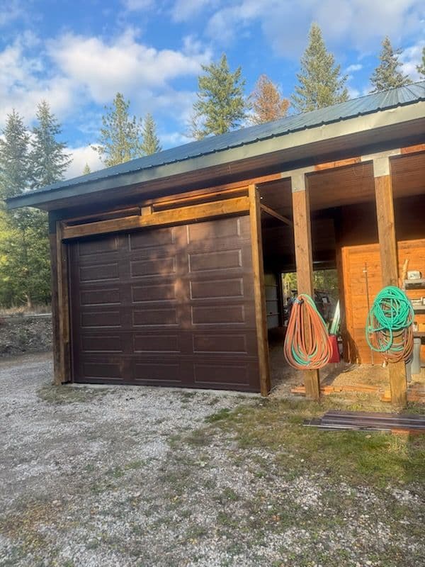 Seamless Garage Door Installation in Rustic Setting